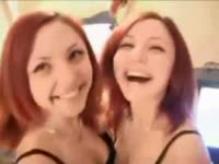 Playful redhead eighteen-year-old twin sisters kissing and stripping for their first video